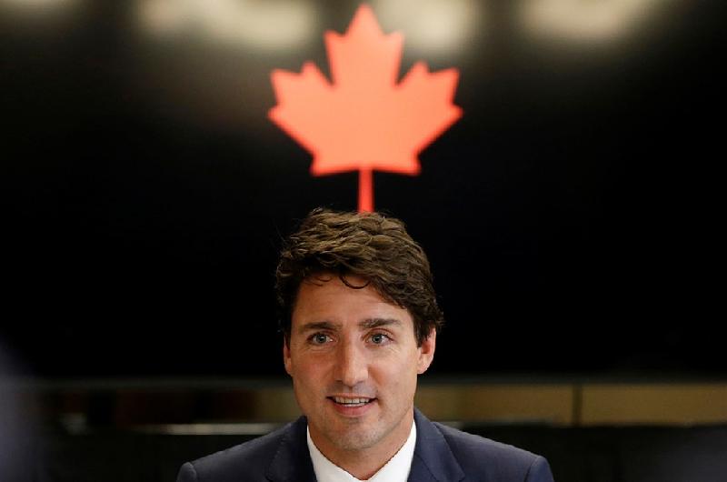 Thủ tướng Canada Justin Trudeau xuất hiện trong cuộc gặp gỡ với các thành viên của Câu lạc bộ Doanh nhân Trung Quốc tại thành phố Quebec, Canada. Vị thủ tướng trẻ thứ hai trong lịch sử Canada từng gây thích thú trên mạng xã hội vì những bức ảnh chụp khoảnh khắc đời thường. Ảnh: 