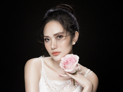 Hoa hậu Diệu Linh gợi cảm, e ấp bên hoa hồng