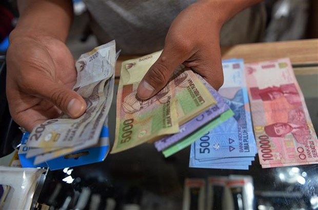 Đồng tiền rupiah của Indonesia. (Ảnh minh họa: AFP/TTXVN)