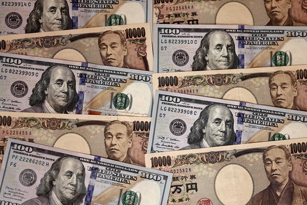 Đồng yen của Nhật Bản và đồng USD. (Ảnh: AFP/TTXVN)