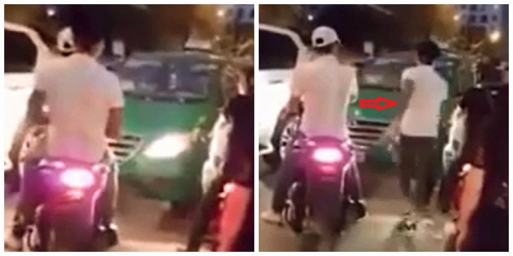 Hai thanh niên đầu trần đi xe máy chặn đầu dọa nạt tài xế taxi chạy lấn làn - Ảnh cắt từ clip
