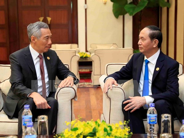 Chủ tịch nước Trần Đại Quang gặp Thủ tướng Lý Hiển Long (Ảnh: TTXVN)